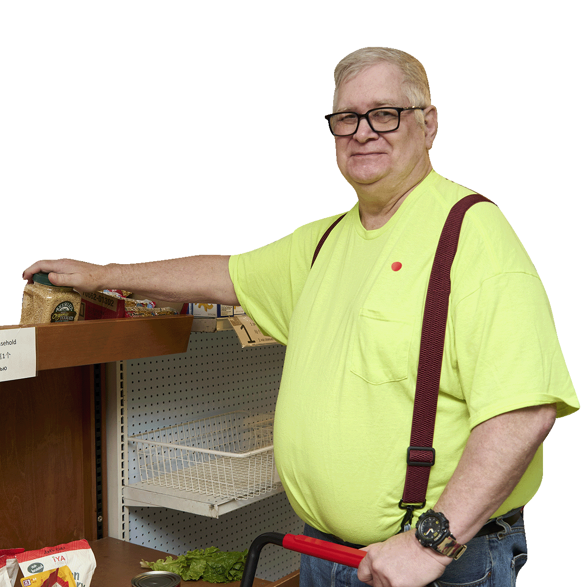 A client shops for dry goods on the shelves of the William Temple House pantry
