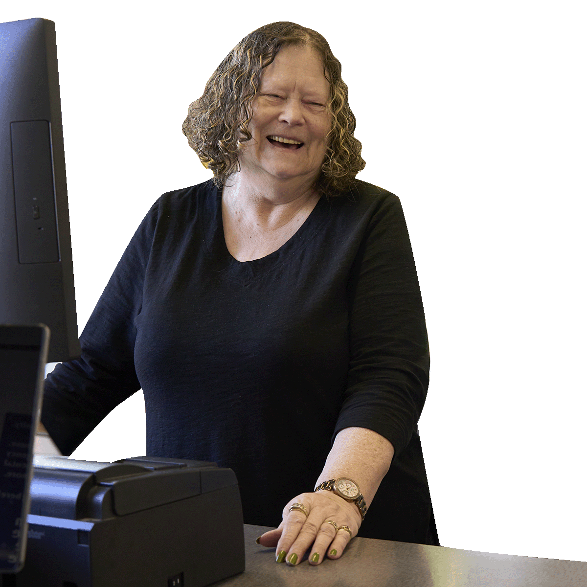 One of our cashiers shares a laugh with a customer while checking out at the William Temple House Thrift Store